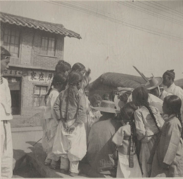 ca.1904 Young boys and girls in traditional customs in the street on Lunar New Year.jpg